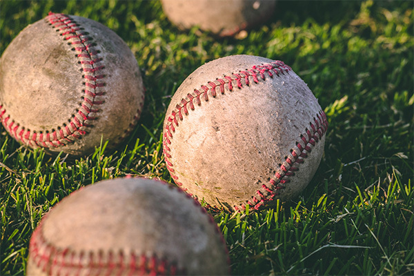 baseballs on the grass