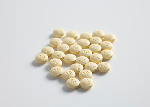 yellow round pills