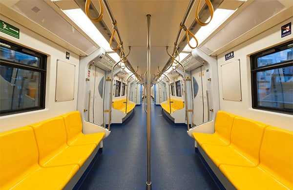 inside of train with yellow seats
