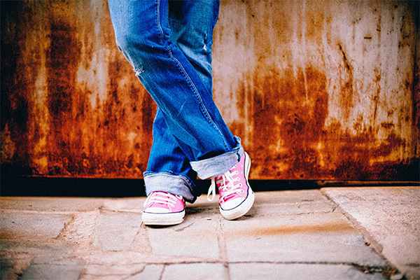 teenager wearing pink shoes