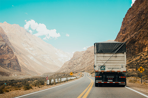 truck driving through the mountains